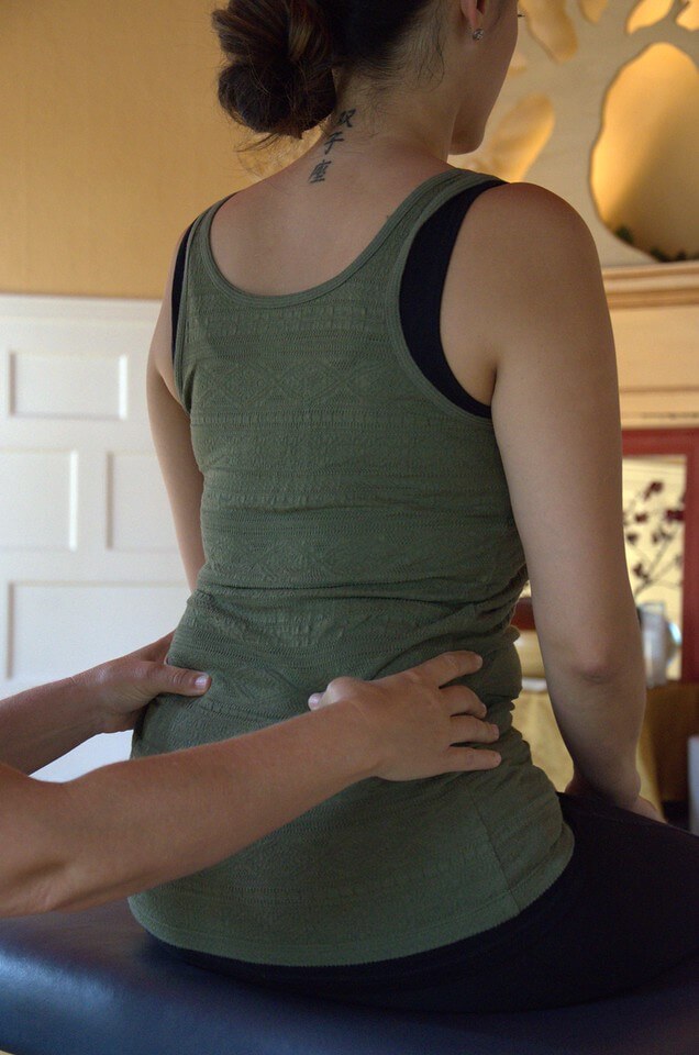 Patient receiving a spinal adjustment